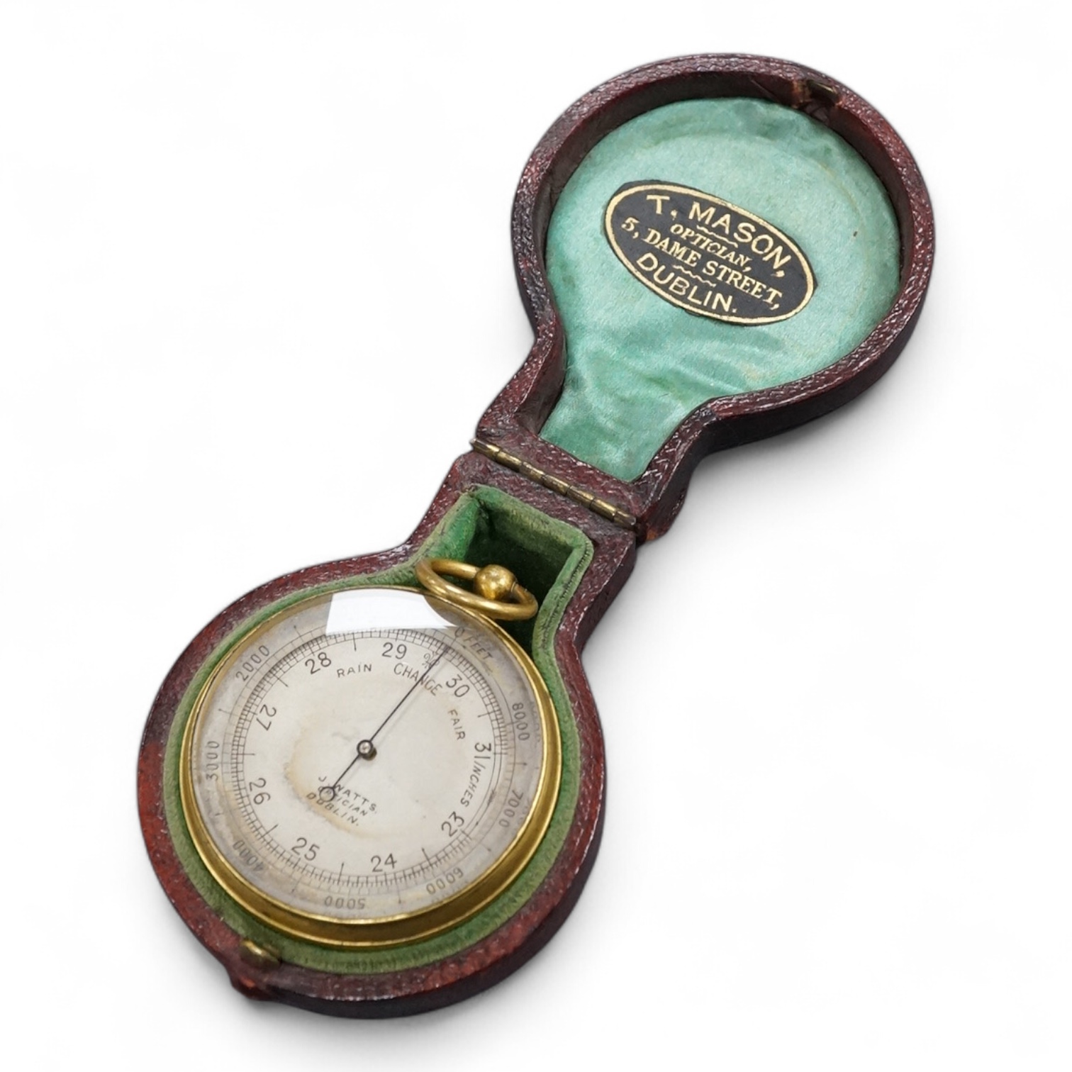 A pocket aneroid barometer by J. Watts, Optician, Dublin, in a fitted leather case with a label for ‘T. Mason, Optician, 5, Dame Street, Dublin’, to the inside of the lid.
